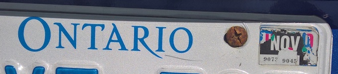 Image of a licence plate with sticker peeled off